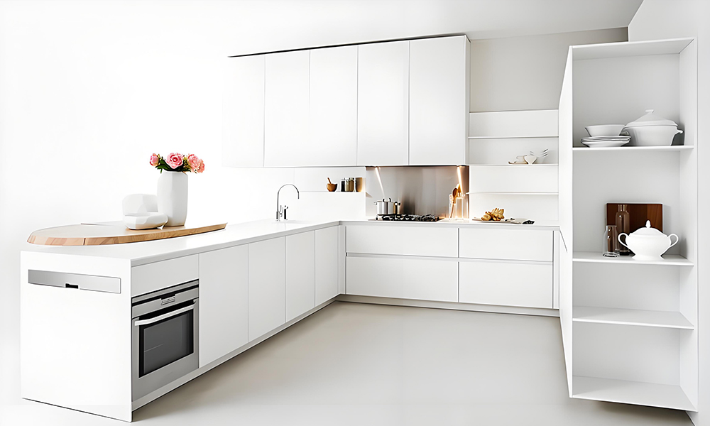 A close-up view of a U-shaped kitchen featuring white cabinetry. The bright white cabinets create a clean and modern aesthetic, while the U-shape layout maximizes workspace and storage, making the kitchen both functional and visually appealing.