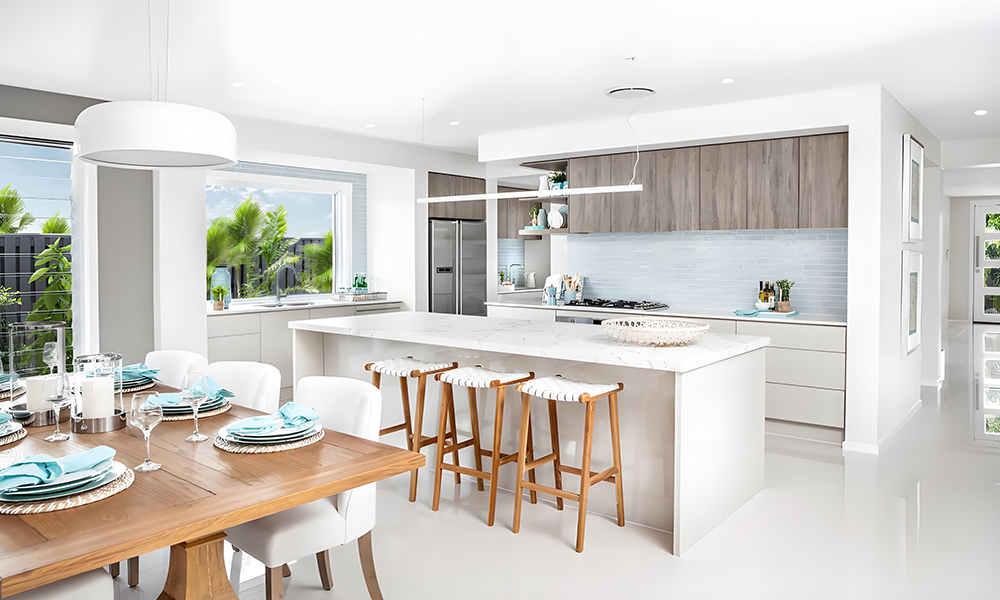 A modern one-wall kitchen featuring white lacquer base cabinets, wood veneer upper cabinets, and a central island. The combination of glossy white surfaces and natural wood tones creates a stylish contrast, while the streamlined layout and island enhance the contemporary and functional design of the space.