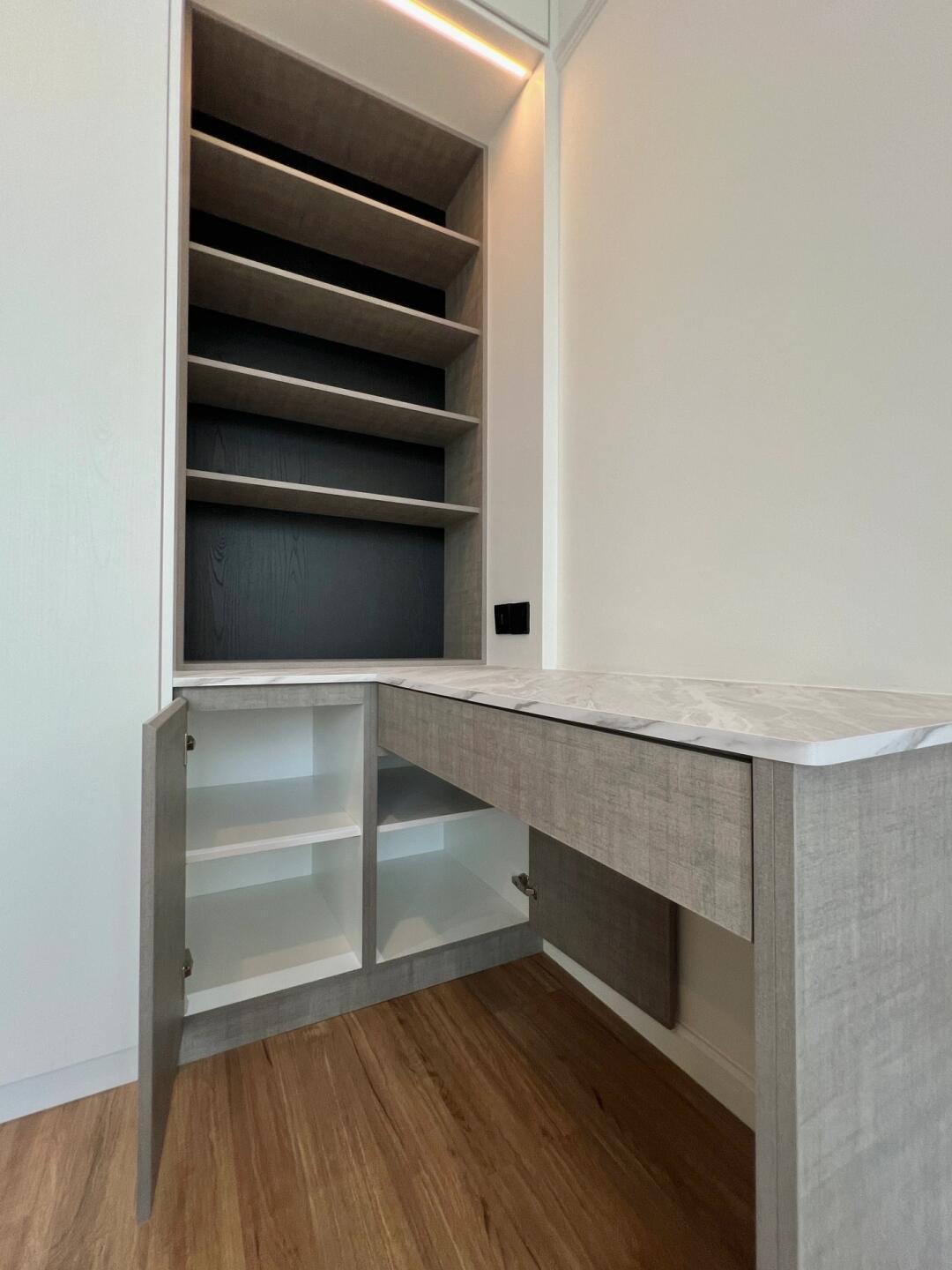 Contemporary white melamine wardrobe with sliding doors and black handle detail.
