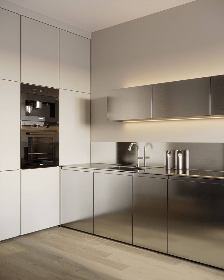 Stainless steel cabinet countertops used in a minimalist industrial kitchen.